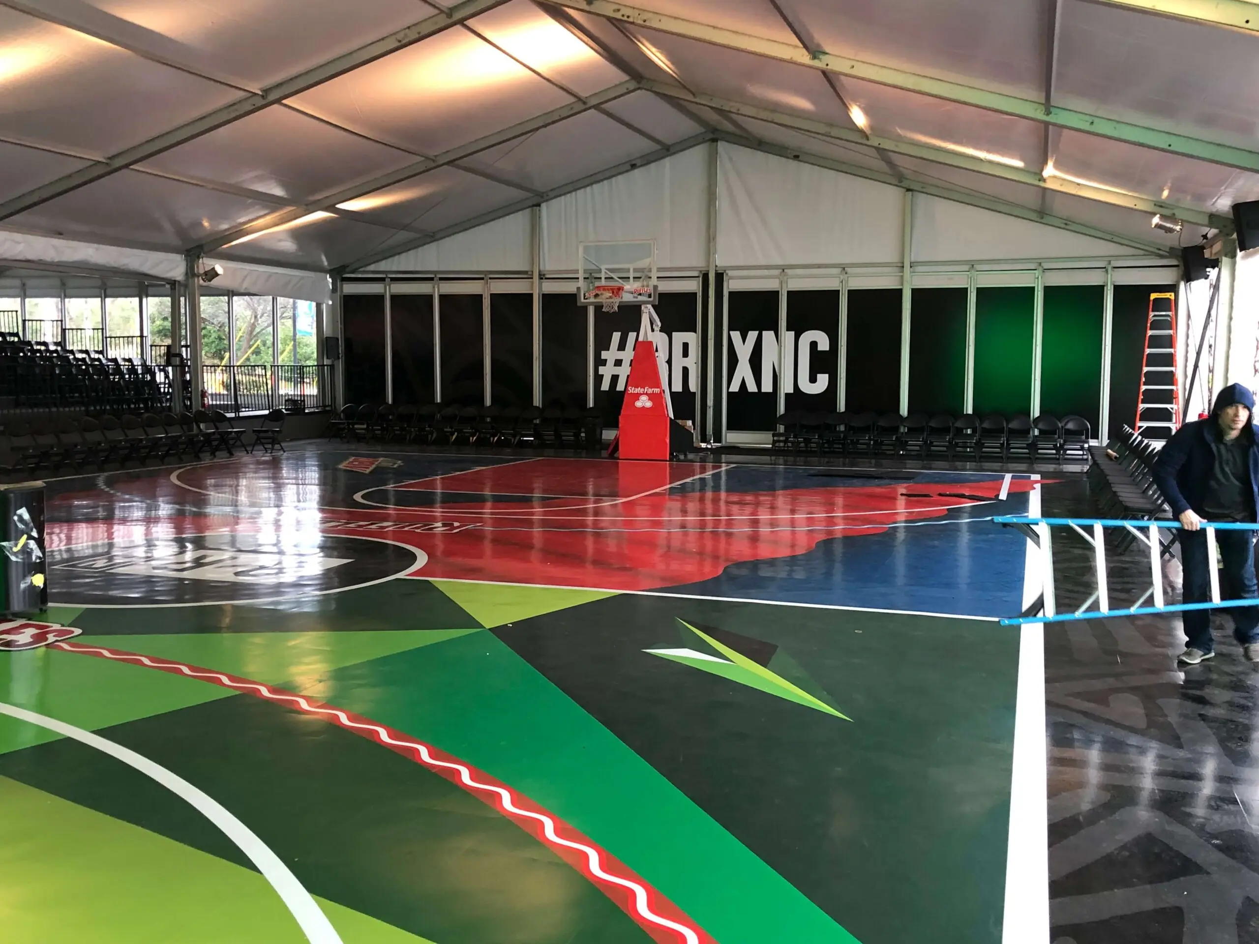 Custom basketball court graphics inside an event tent