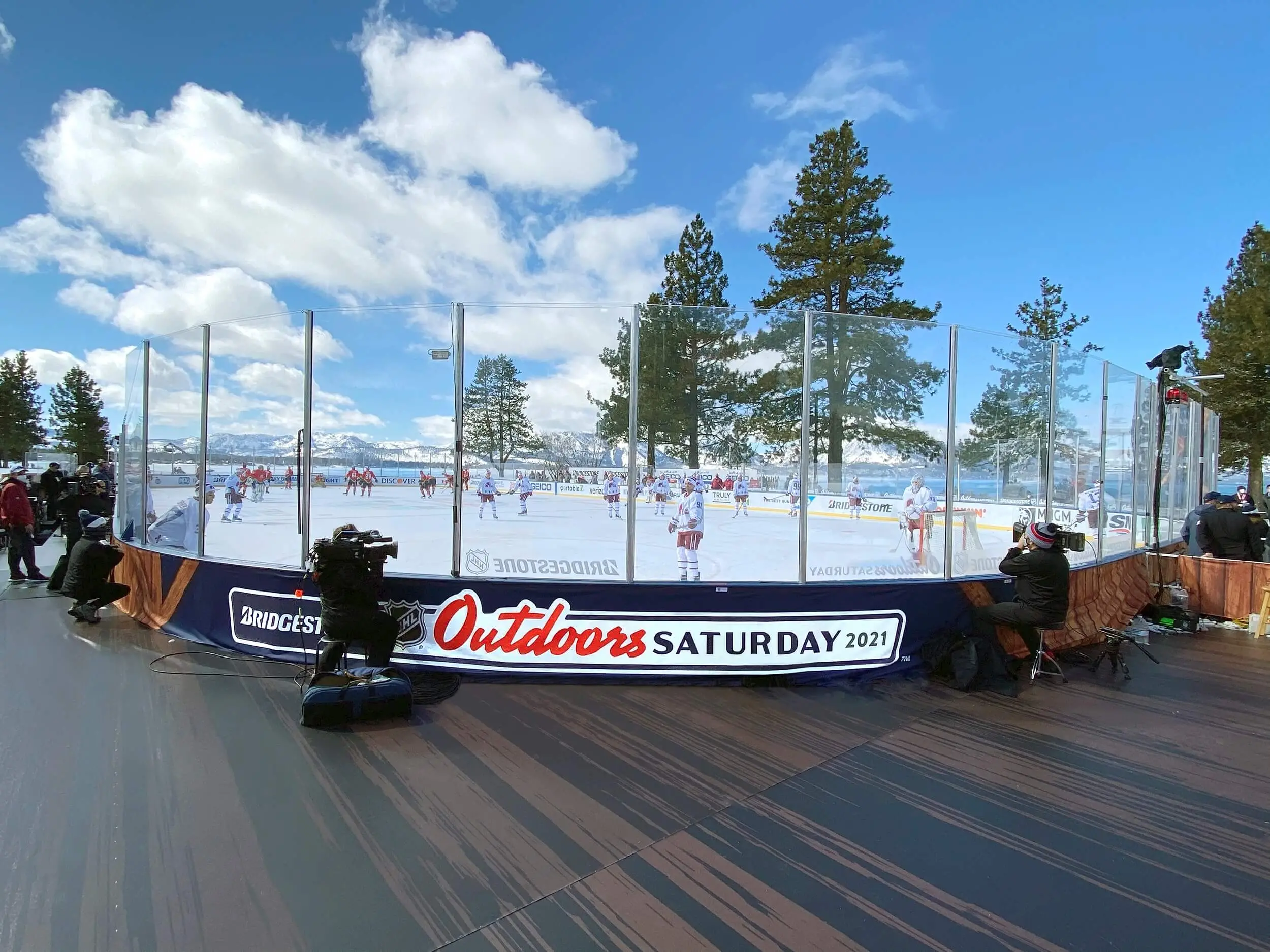 Outdoor hockey rink with dasher board graphics