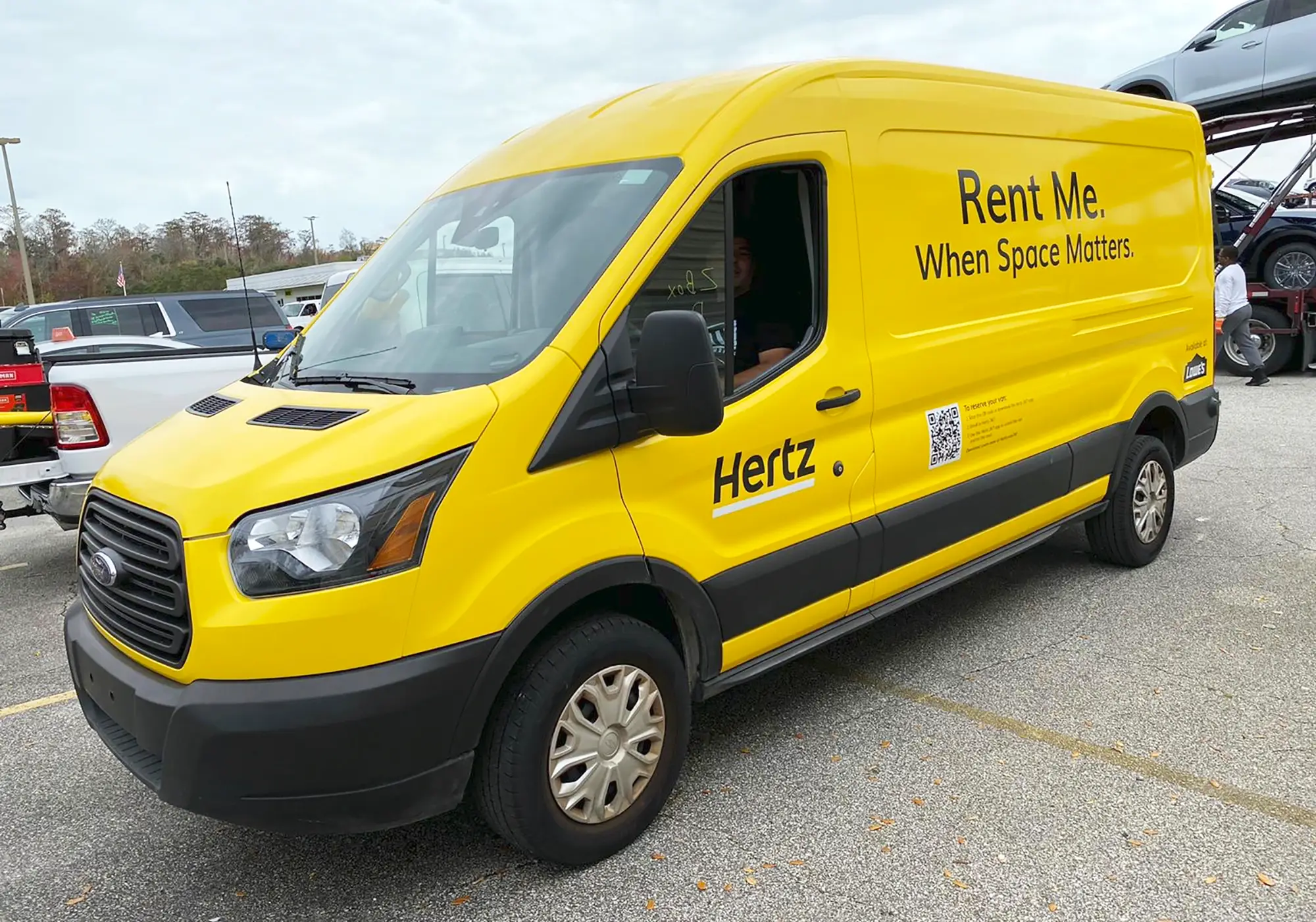 Yellow Hertz rental van wrap