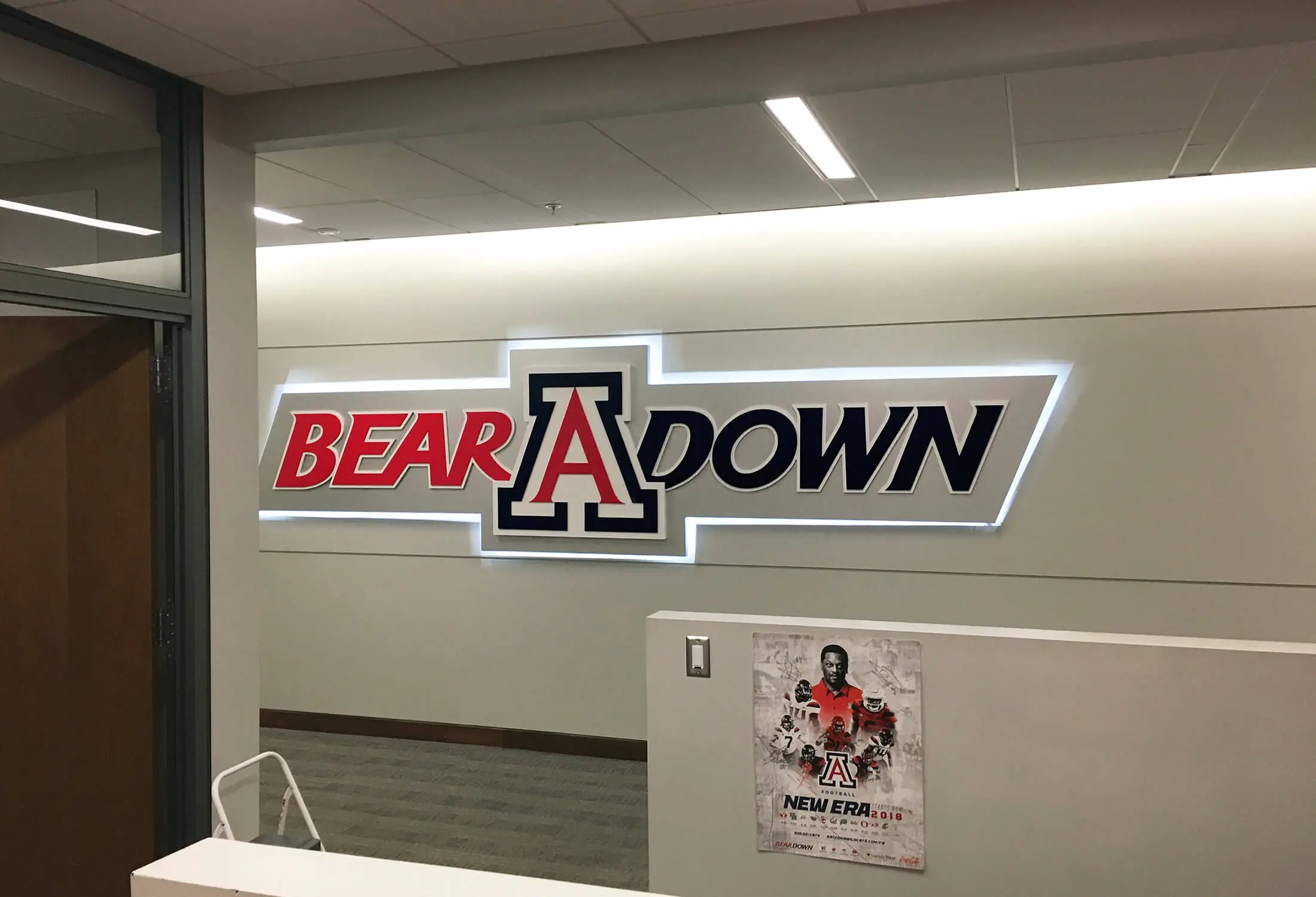 Lit “Bear Down” wall sign, University of Arizona